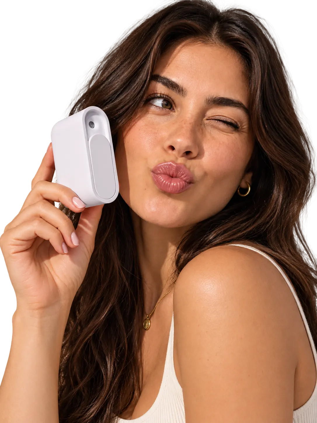 Woman holding the breath spray device to her cheek in a kiss pose, cutout